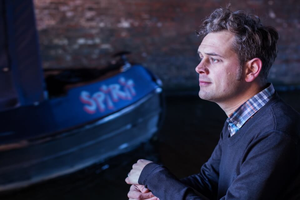 Photographic Portrait of Luke Kennard, with a canal barge in the background